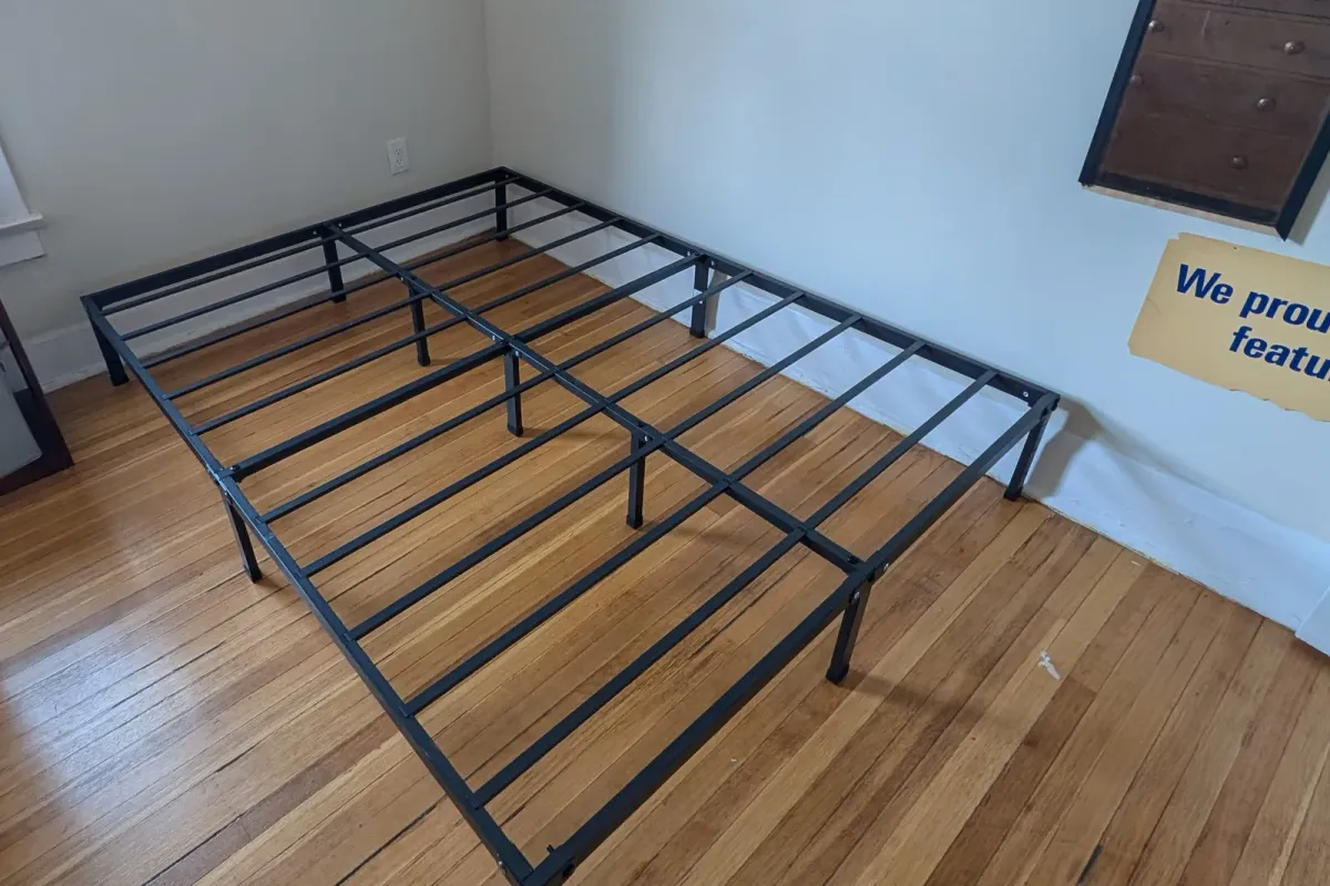 Black metal platform bed frame assembled in its place